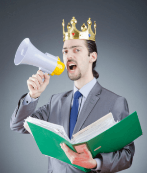 Man with a bullhorn in a crown